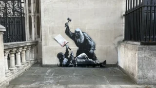 London police opened an investigation into Banksy after graffiti appeared on the Royal Courts of Justice, raising questions about the anonymous artist&rsquo;s real identity.