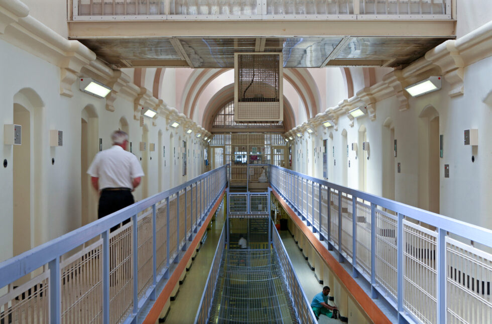 Nearly 40 inmates were incorrectly freed from prisons in England and Wales under a new early release scheme designed to ease overcrowding. Five remain at large, and one committed a new sex crime.