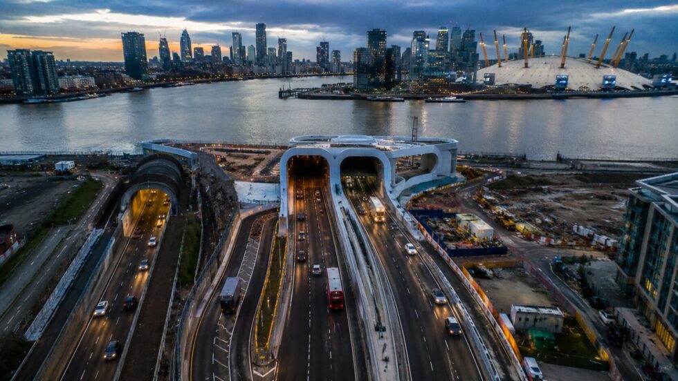Silvertown Tunnel one year on: Blackwall northbound journeys 58% quicker in the morning peak, over-height closures down 23%, bus trips up 290%, NO₂ down 17% — yet toll revenue came in at £67m against a £100m forecast, and campaigners insist the charge, not the tunnel, cut the queues.